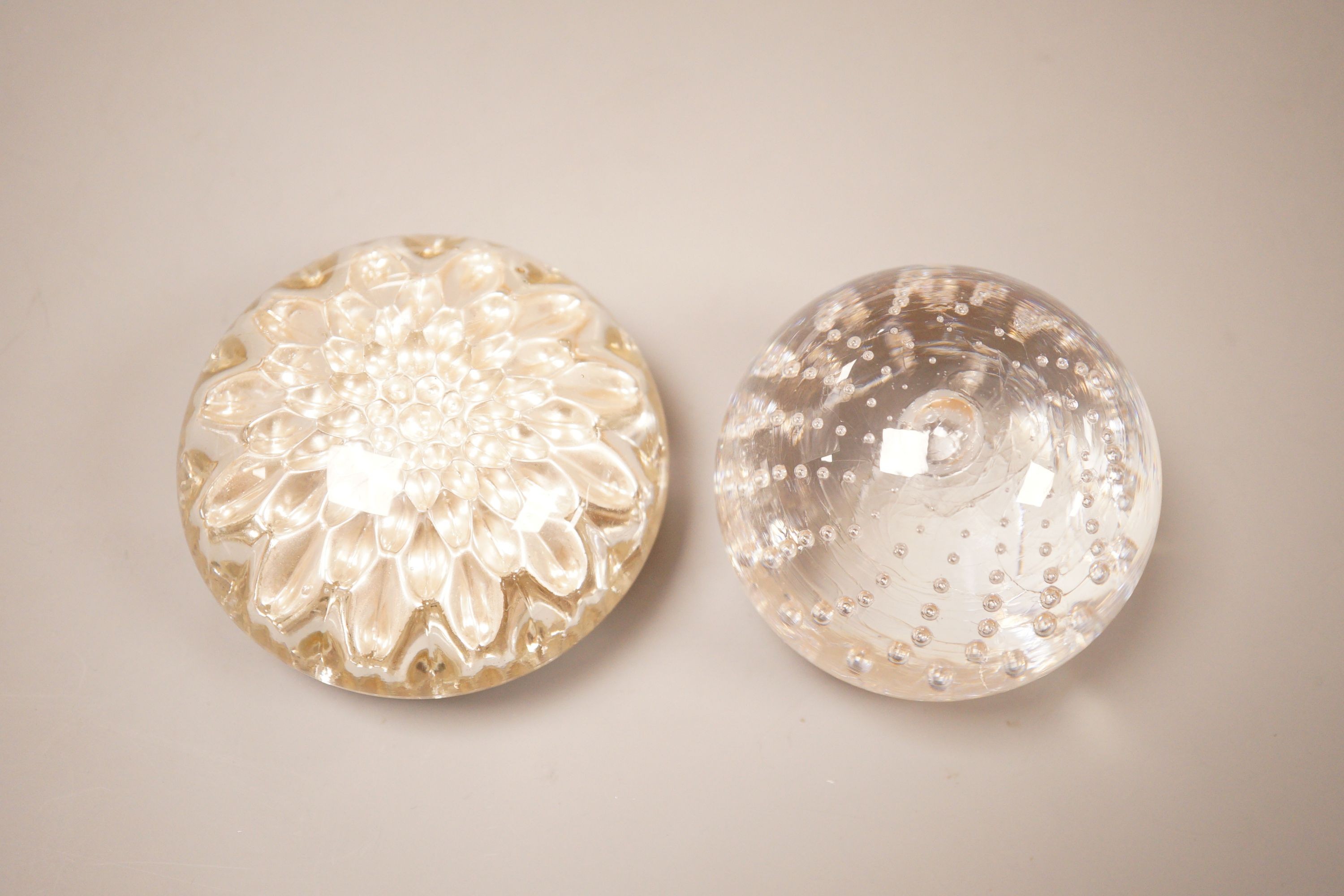 A early 20th century French glass paperweight together with another